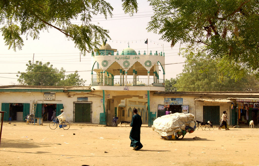 A man walks along a street in northern Nigeria.