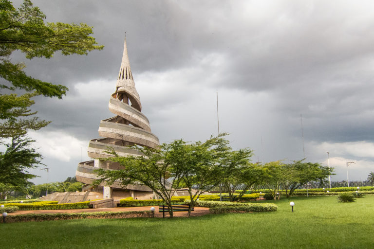 Reunification Monument - Yaoundé surrounded by grass and trees