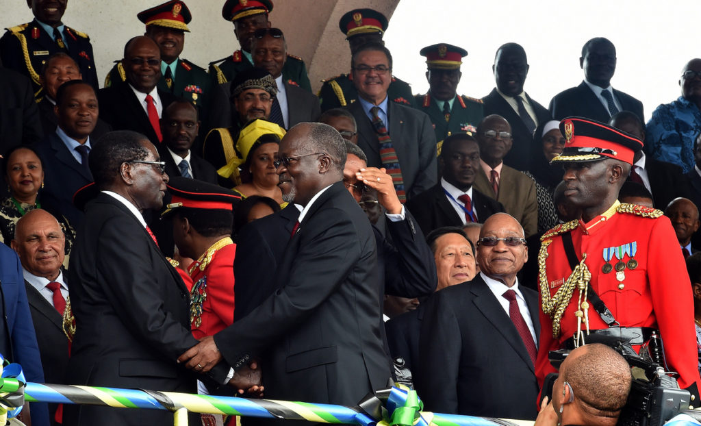Newly inaugurated President John Pombe Magufuli greets President of Zimbabwe Robert Mugabe.